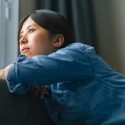 Sad woman looking out the window