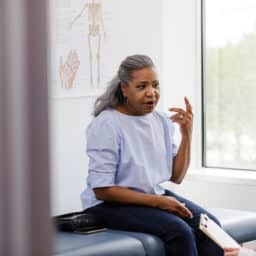 Woman talking to an audiologist about her hearing loss.
